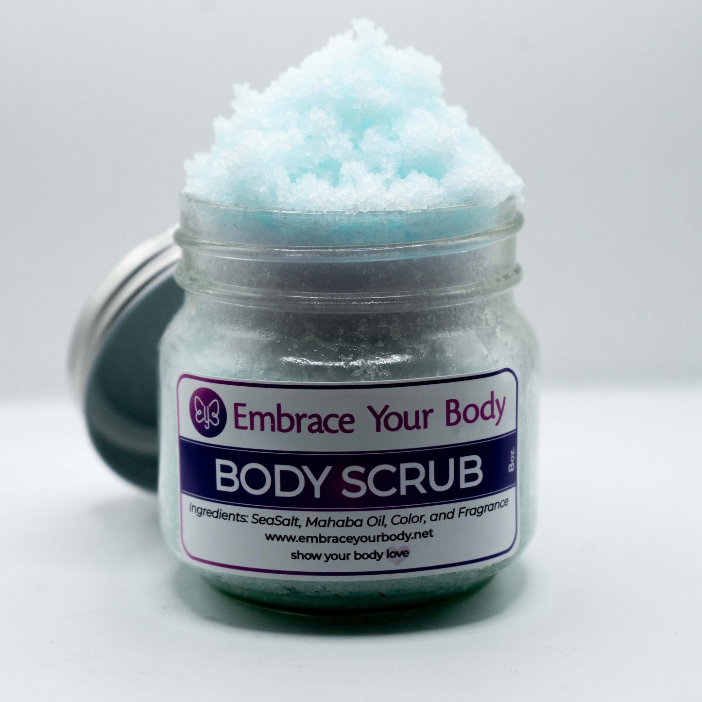 All-natural body scrub in glass jar"